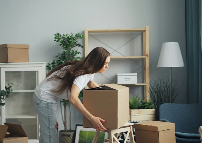 Woman unpacking boxes